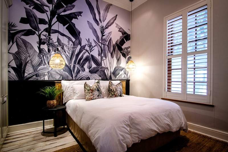 Bedroom with botanical mural wallpaper
