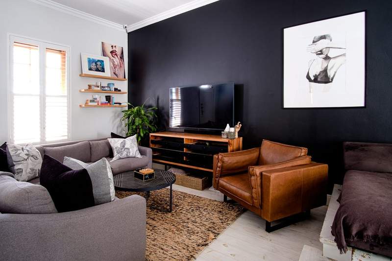 Living room with dark feature wall