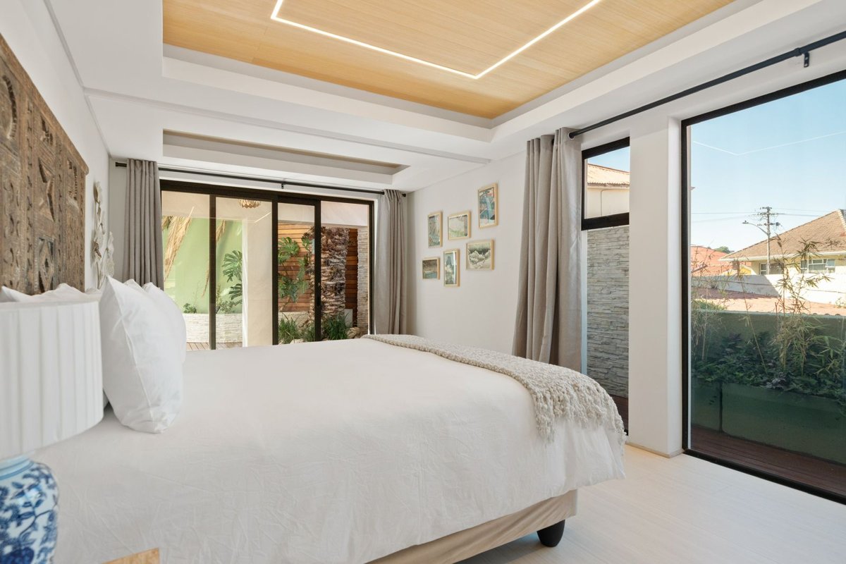 Styled bedroom with courtyard views